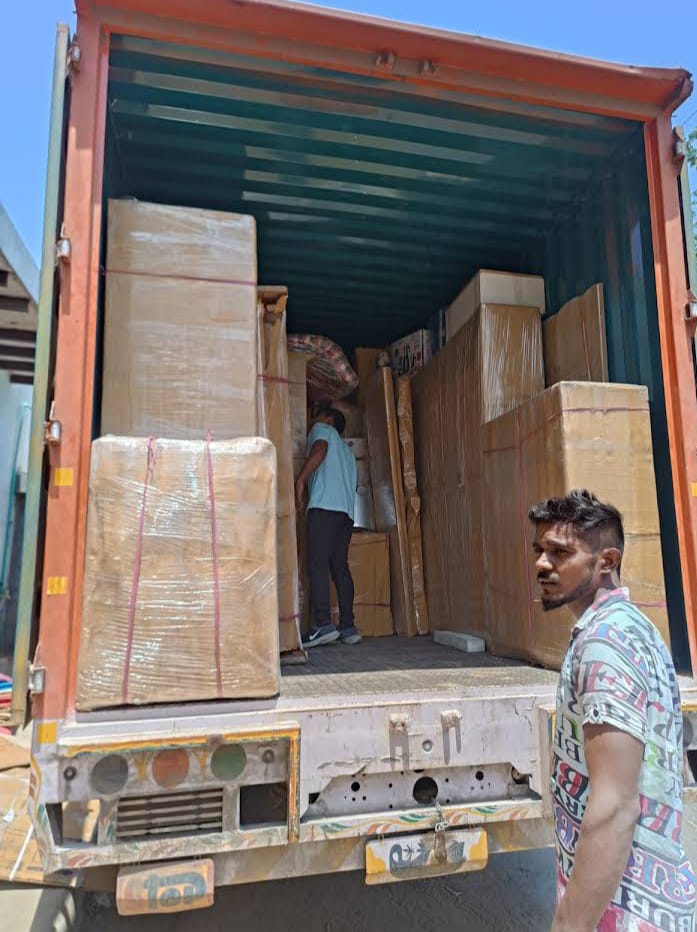 Packed cartons inside container truck